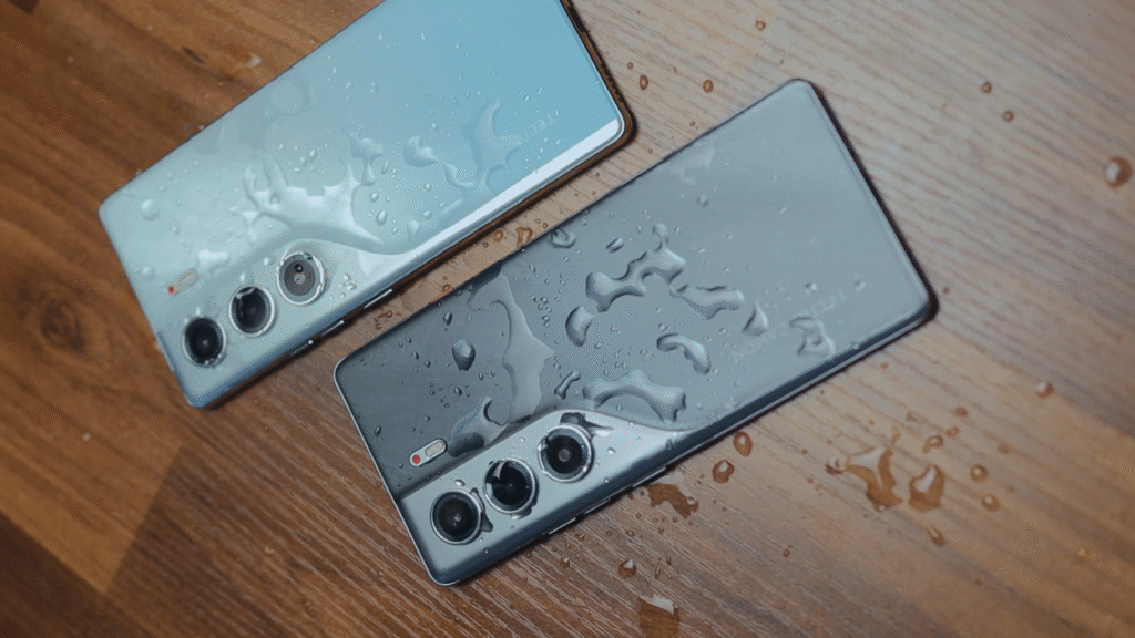 Two Tecno Camon 40 Pro 4G smartphones resting on a wooden surface, showcasing water droplets on their surfaces, highlighting the water resistance feature.