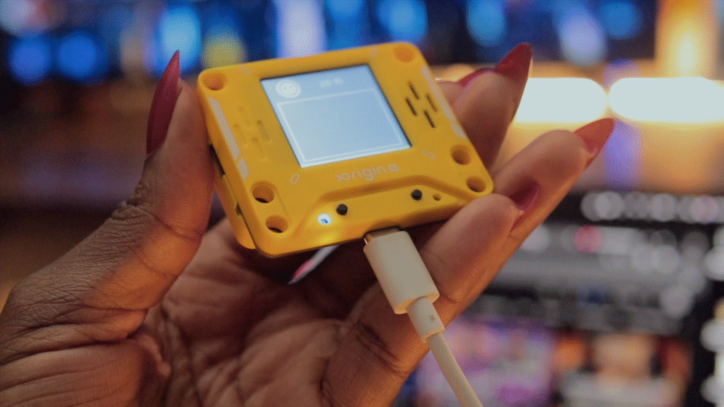 AI PI Lite device in action showing conversational AI interface on 128x128 pixel screen