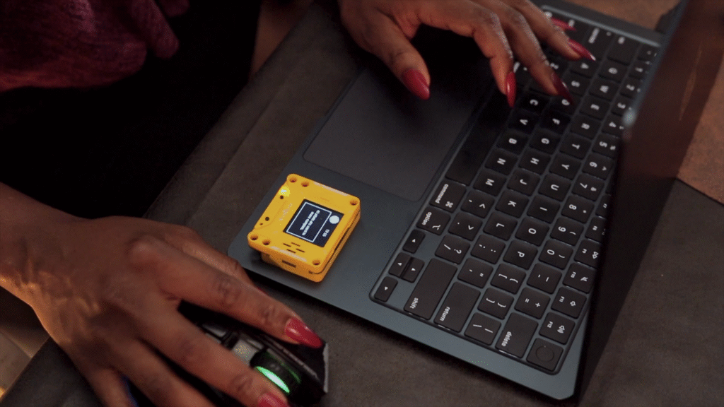 AI PI Lite device in action showing conversational AI interface on 128x128 pixel screen