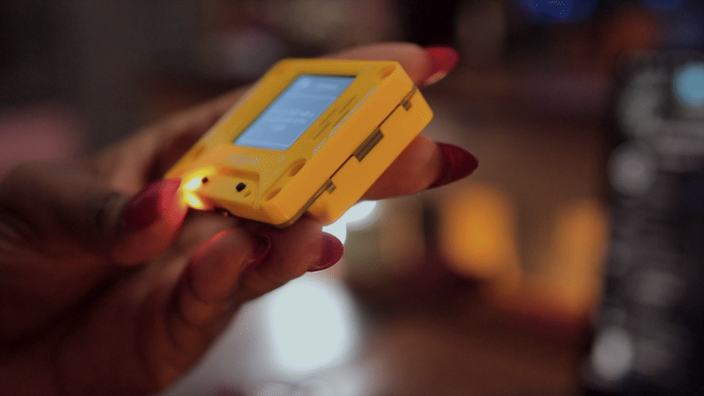 AI PI Lite device in action showing conversational AI interface on 128x128 pixel screen